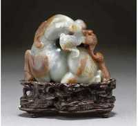 18th Century A grey and russet jade ram group